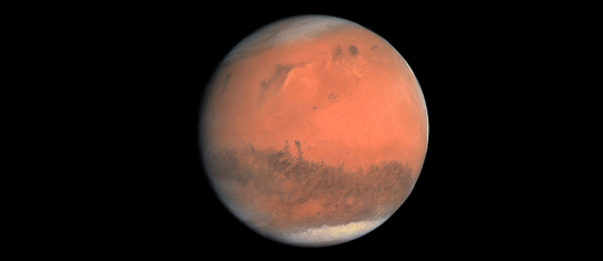 2007년 탐사선 로제타가 촬영한 화성의 모습. 극 부근의 극관이 보이고 특유의 붉은색 산화철 토양이 보인다.